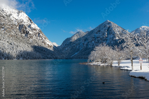 cold mountain lake in austrian alps at winter