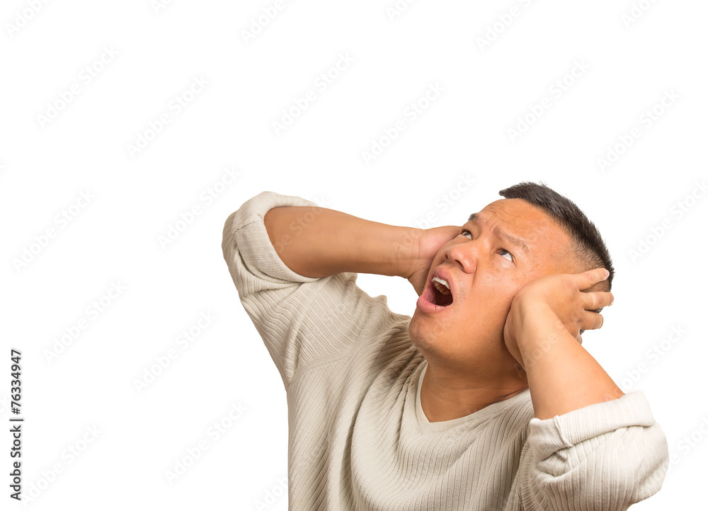 unhappy stressed man covering ears looking up white background unhappy stressed man covering ears looking up white background