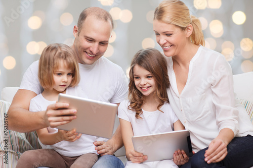 family and two kids with tablet pc computers