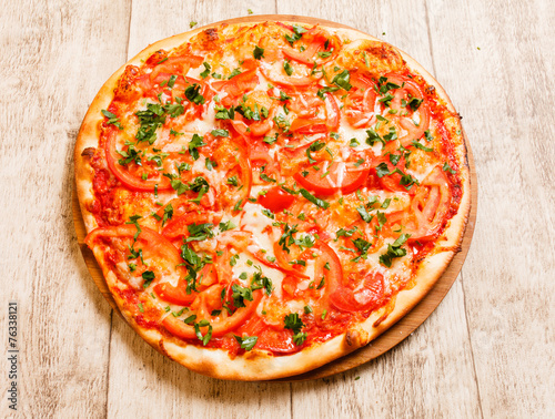 pizza on the wood background