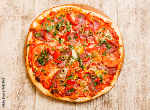 pizza on the wood background