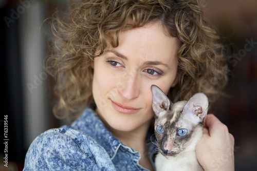 Close-up of a woman and cat