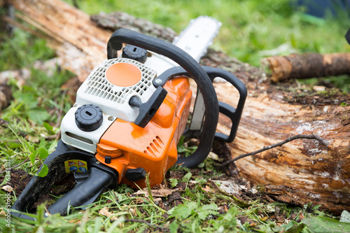 Wallpaper Mural chainsaw and log Torontodigital.ca