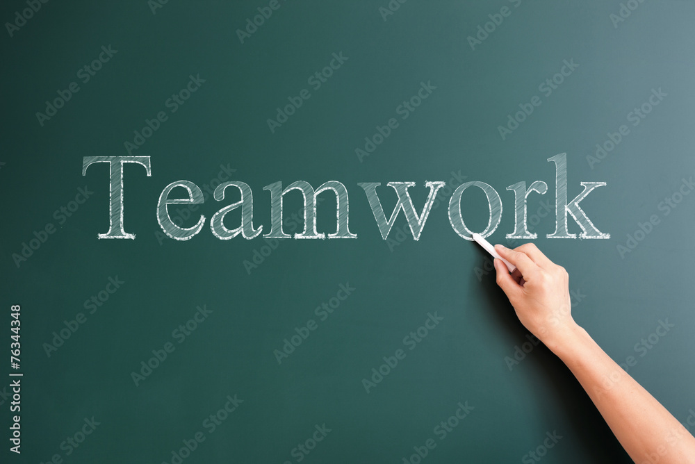 teamwork written on blackboard teamwork written on blackboard