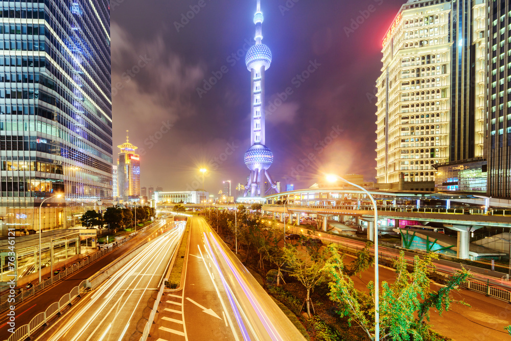 the light trails on the modern building background in shanghai c
