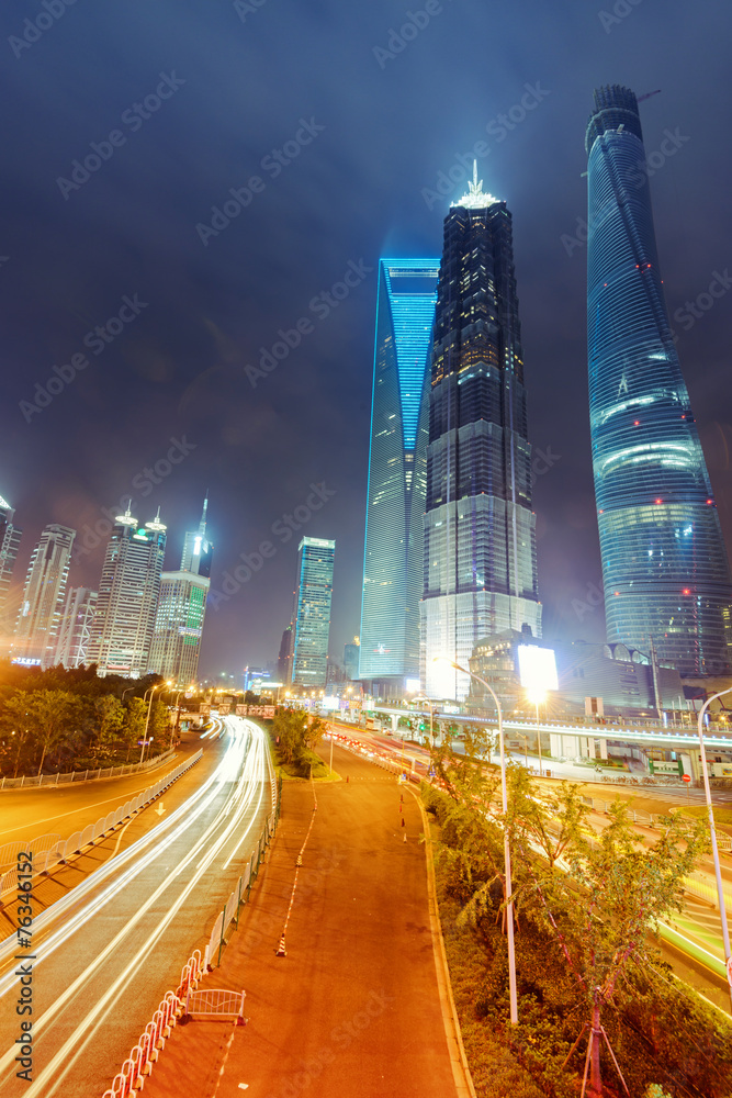 Fototapeta premium the light trails on the modern building background in shanghai c