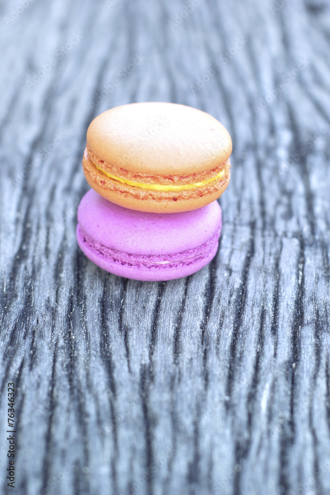 French macaroons on a wooden floor French macaroons on a wooden floor