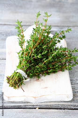 Fragrant thyme on a white chopping board