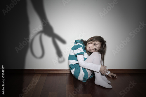 Domestic violence - sad lonely youth girl photo