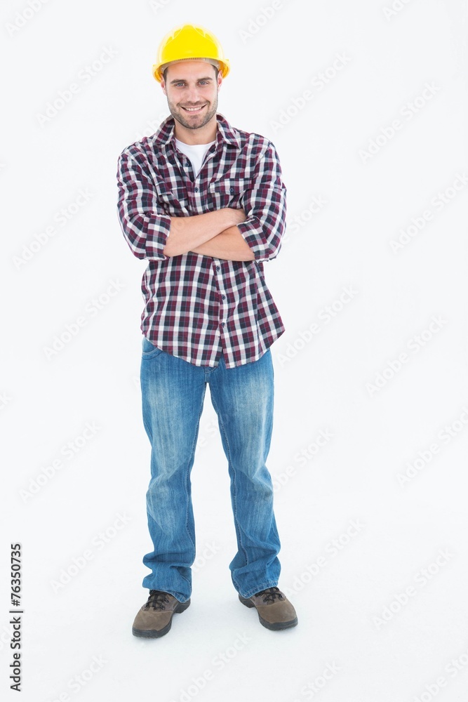 Handome male handyman standing arms crossed Handome male handyman standing arms crossed