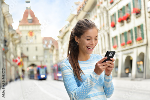 Woman on smart phone in Bern Switzerland photo