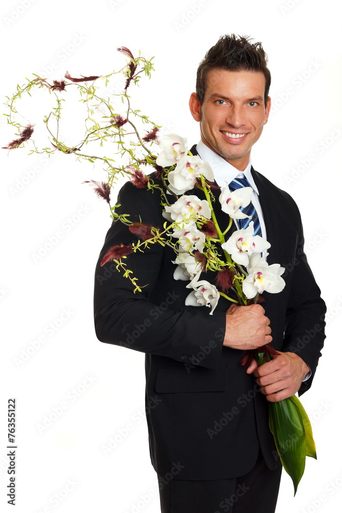 Handsome businessman in suit with flowers orchid Handsome businessman in suit with flowers orchid
