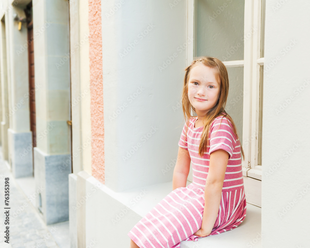 Adorable little girl resting outdoors on a nice sunny spring day Adorable little girl resting outdoors on a nice sunny spring day