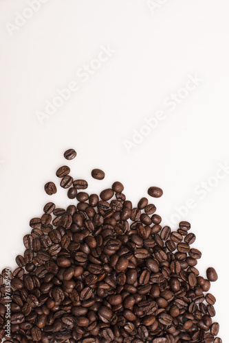 Brown coffee beans isolated on white background