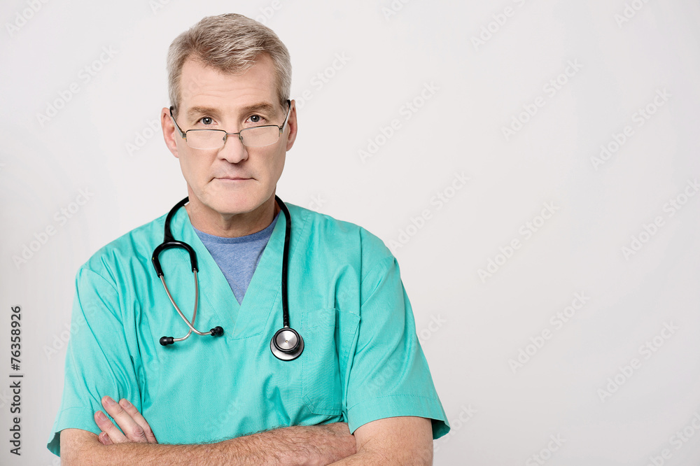 Senior doctor looking at camera Senior doctor looking at camera
