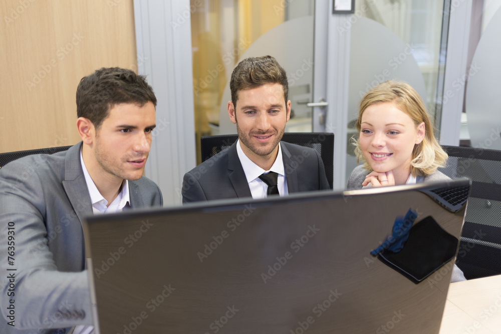 Group of business people in a meeting at office, working on comp Group of business people in a meeting at office, working on comp