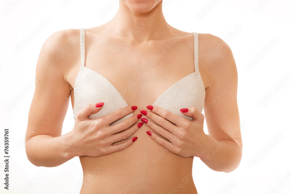 Foto de small breasts in white bra do Stock