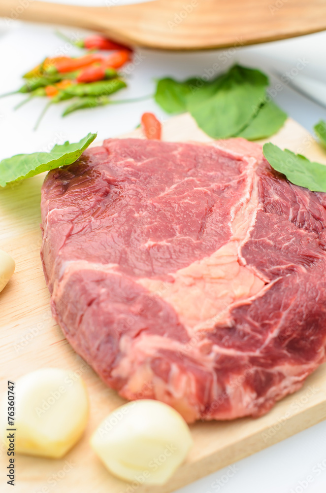 Raw Fresh Meat Slices on Wooden Chopping Board.