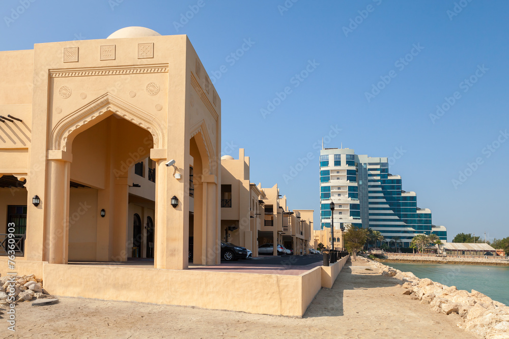 Yellow house fragment with classical Arabic style arch