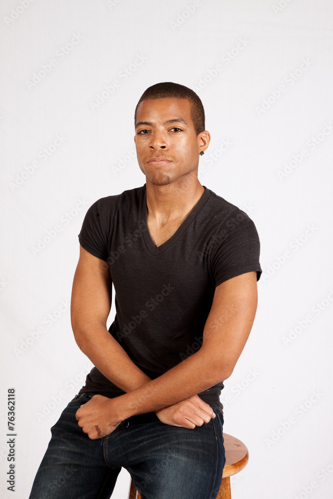 Black man looking thoughtfully at the camera Black man looking thoughtfully at the camera