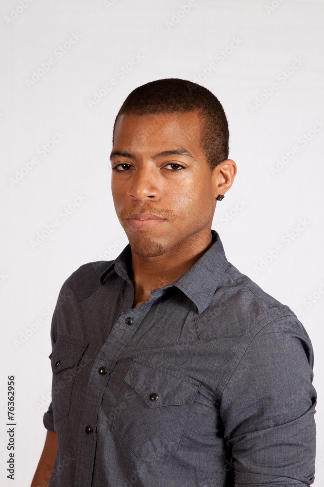 Black man looking thoughtfully at the camera Black man looking thoughtfully at the camera