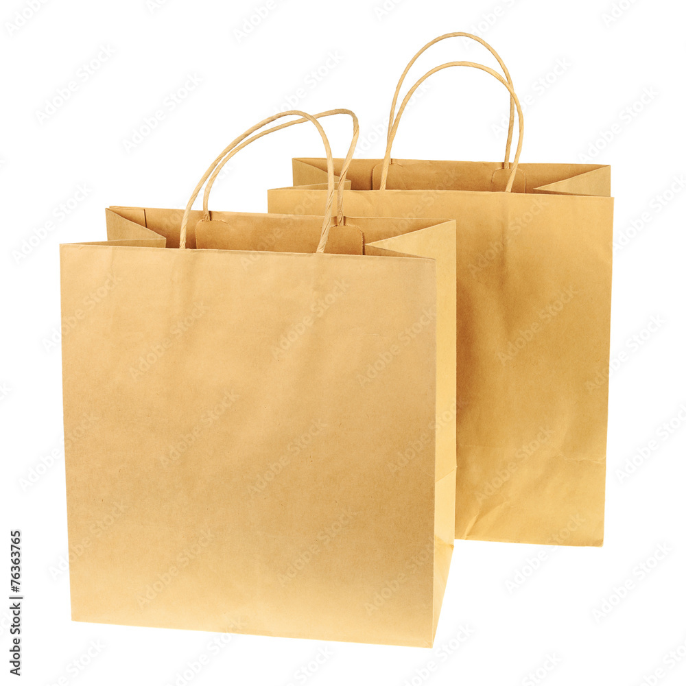 Empty brown recycled paper shopping bags isolated on white backg