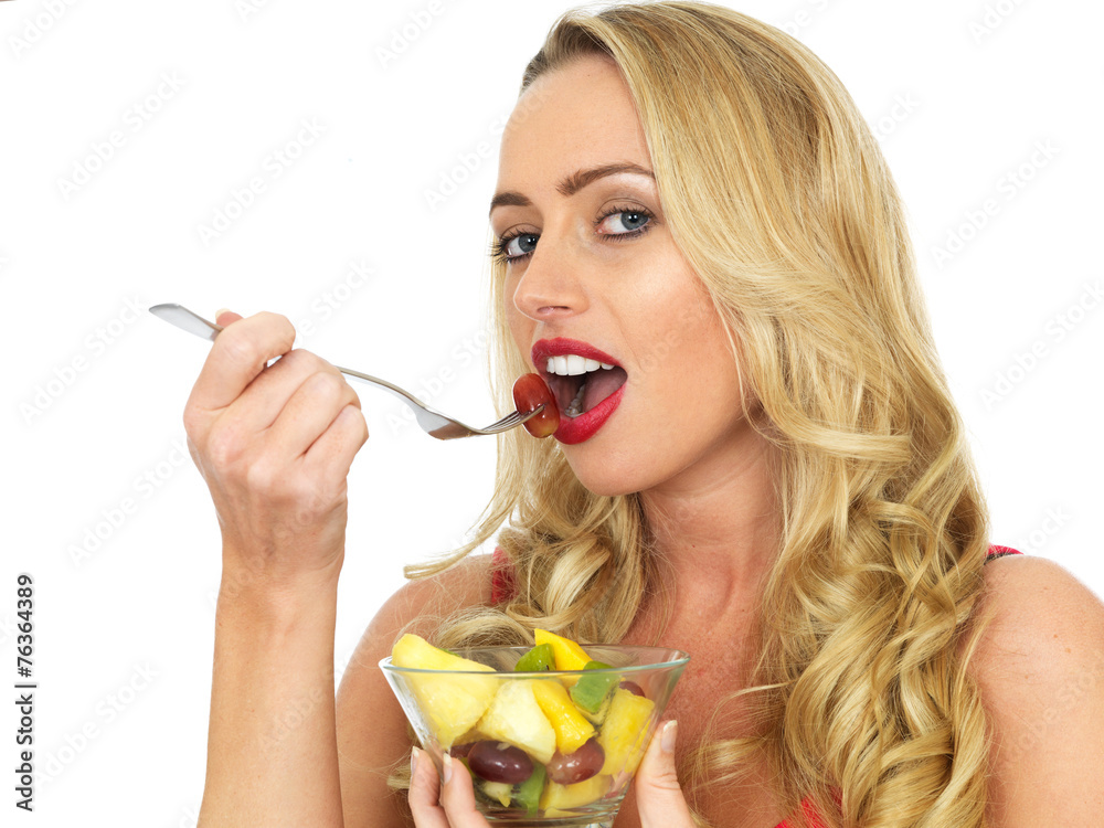 Young Woman Eating Fresh Fruit Salad Young Woman Eating Fresh Fruit Salad