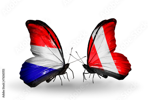 Two butterflies with flags Holland and Peru