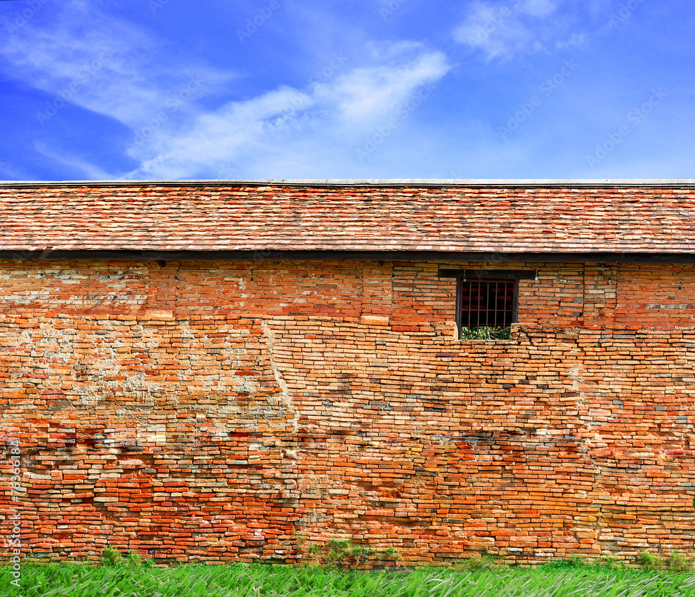old brick wall with blue sky