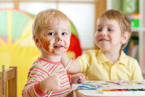 children painting at home or playschool photo