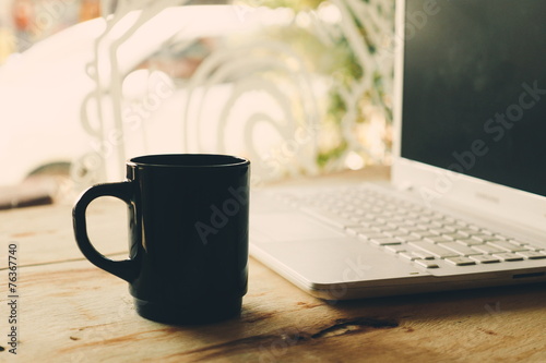 vintage color tone : cup of coffee in coffee shop photo