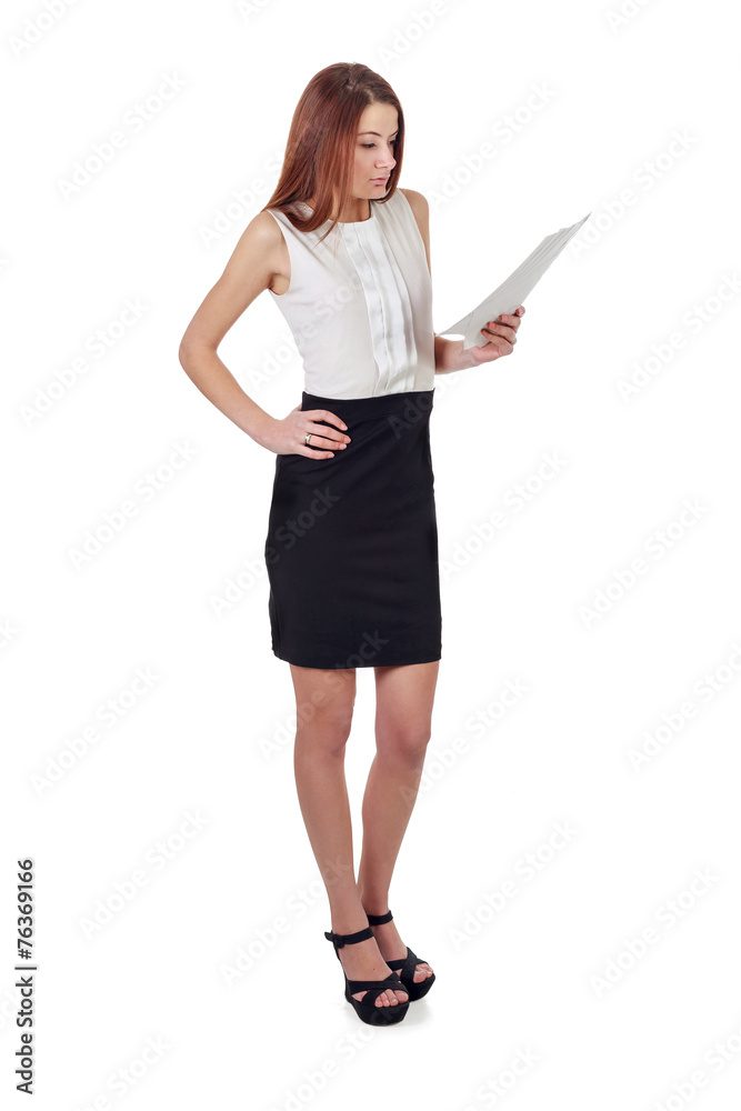Woman in black skirt reading document over white Woman in black skirt reading document over white