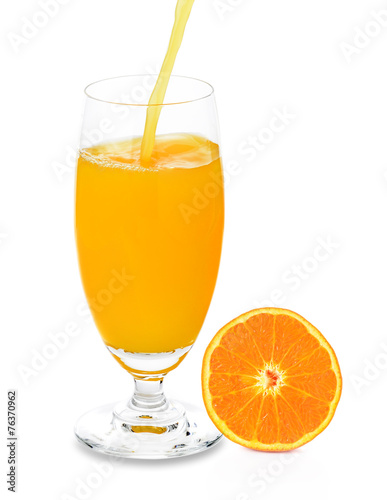 pouring orange juice isolated on white