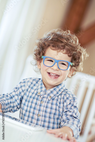 Lovely baby boy wearing glasses. Little genius, scientist