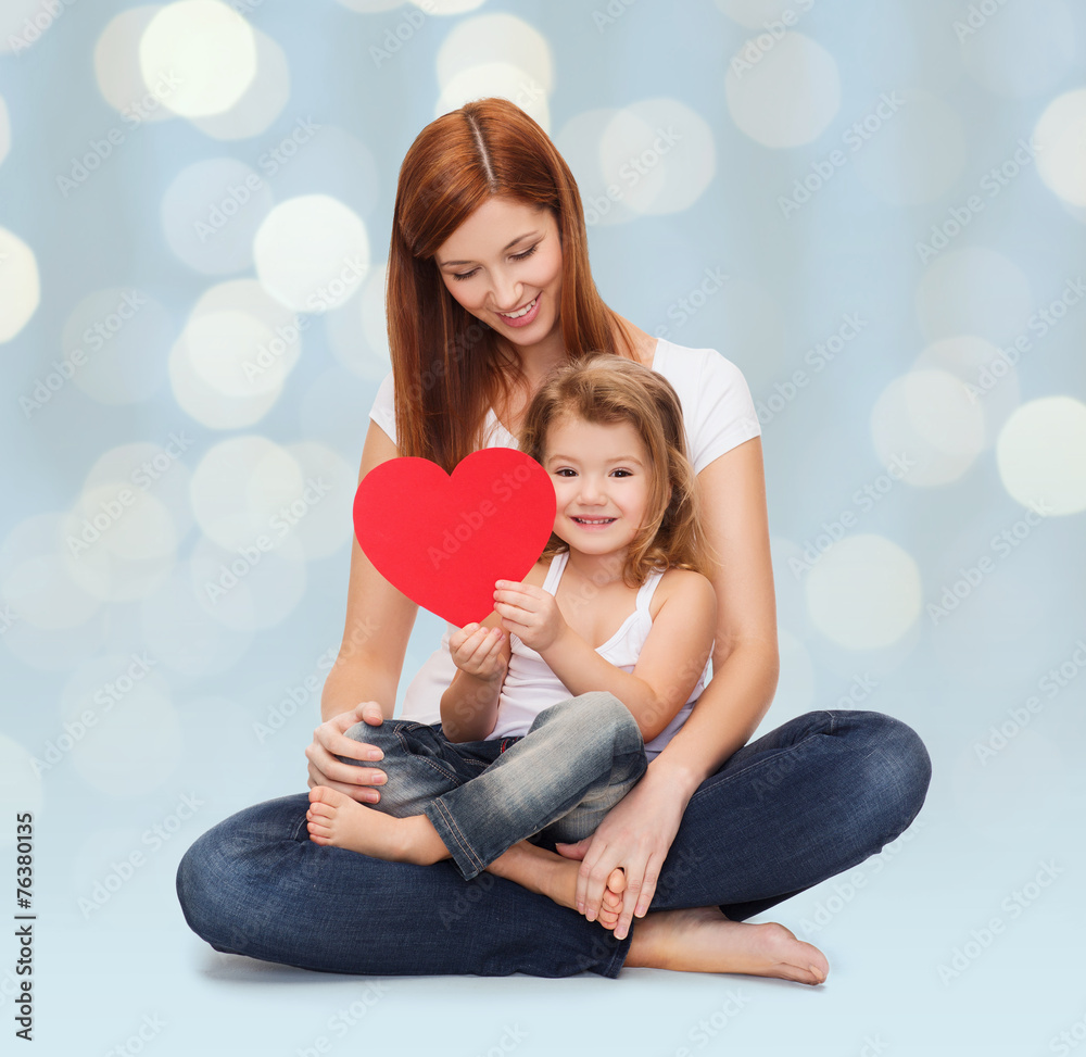 happy mother with little girl holding red heart happy mother with little girl holding red heart
