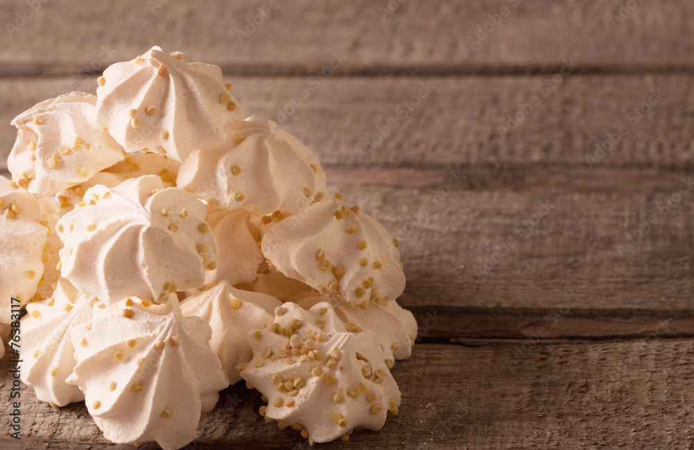 meringue cookies on wooden background meringue cookies on wooden background