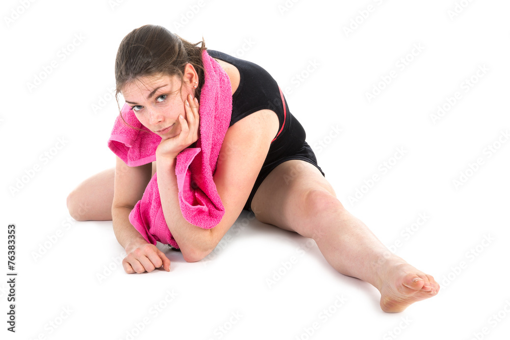 Young woman warming up for a gymnastics exercise Young woman warming up for a gymnastics exercise