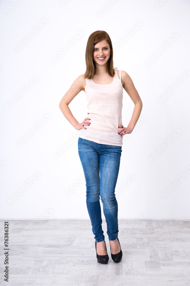 Full length portrait of a happy beautiful woman posing at studio Full length portrait of a happy beautiful woman posing at studio