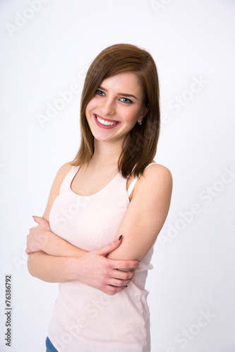 Portrait of a cheerful woman standing over gray background © Drobot Dean