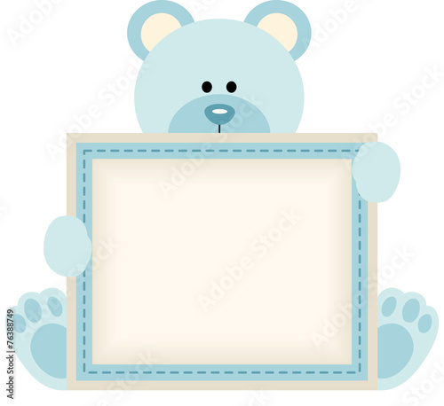 Cute teddy bear holding blank sign for baby boy announcement