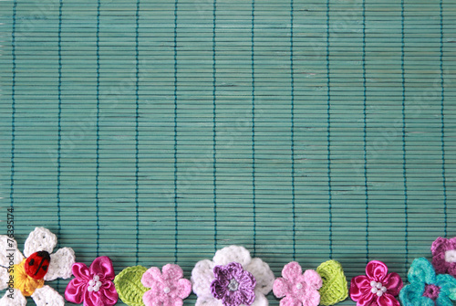green background  with crochet flower and heart