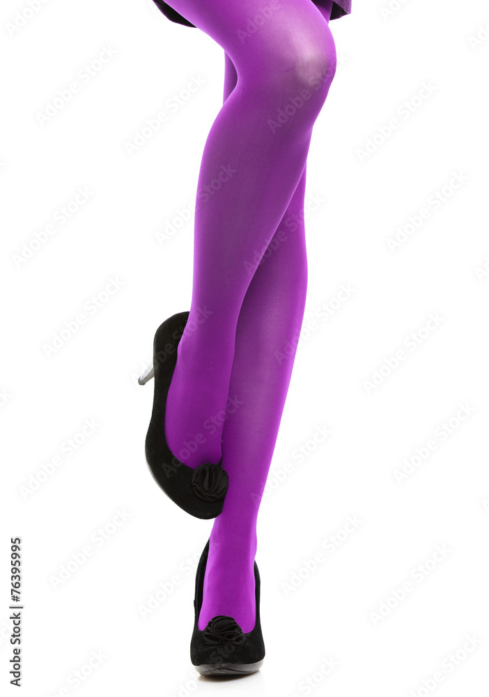 Woman long legs and violet stockings isolated