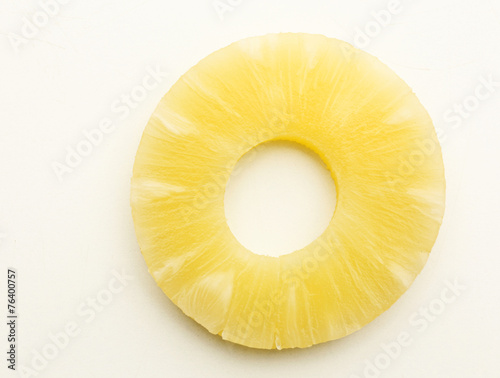 Canned pineapple ring isolated on white