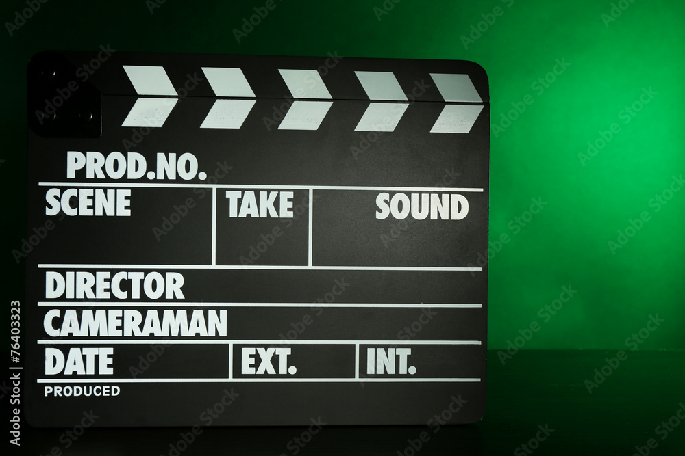 Fototapeta premium Movie clapper on dark color background