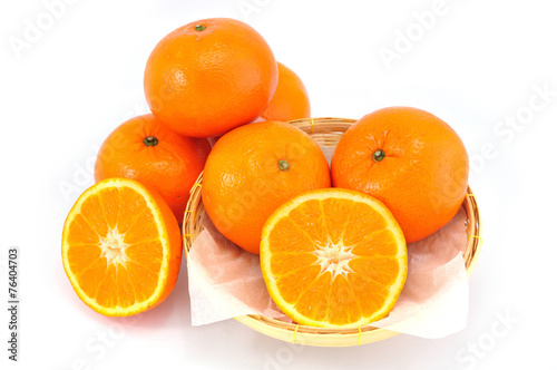 Group of orange fruit on bamboo basket