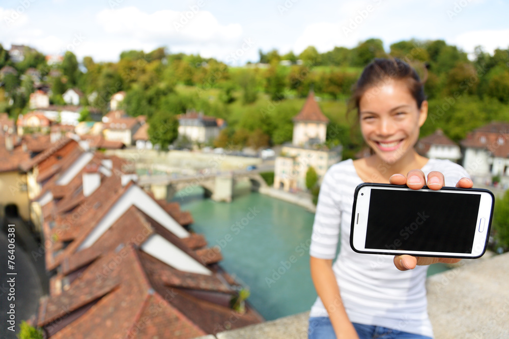 Smartphone screen - Woman showing app in Bern Smartphone screen - Woman showing app in Bern