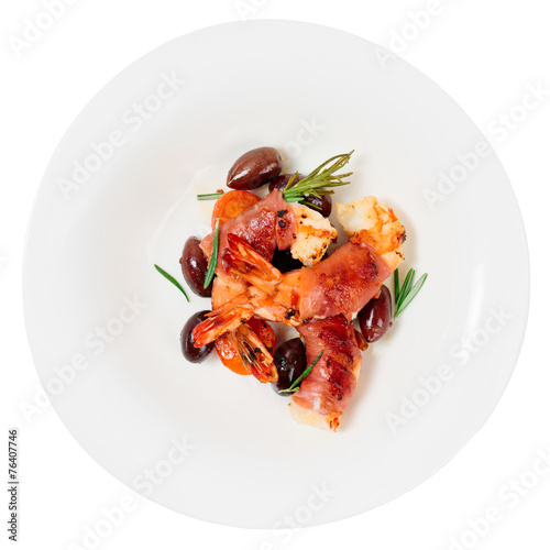 Shrimps with bacon, olives and rosemary, isolated