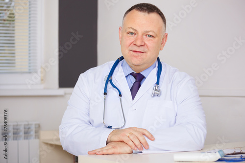 Portrait of Doctor with stethoscope looking at the camera.