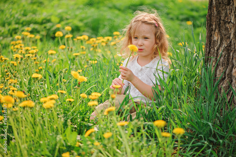 spring portrait of adorable child girl on dandelion field spring portrait of adorable child girl on dandelion field