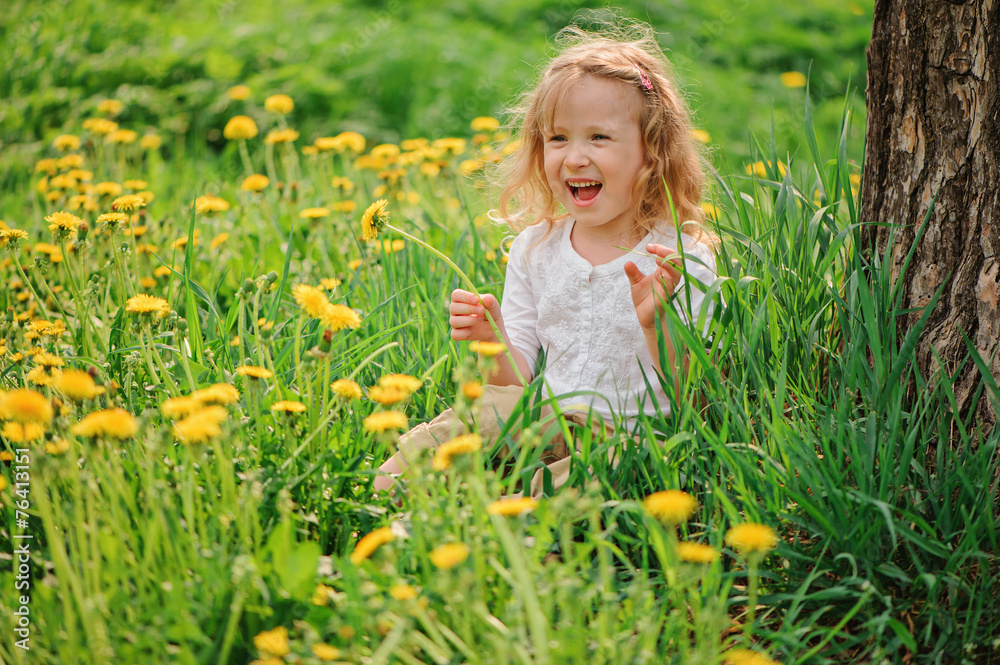 spring portrait of adorable child girl on dandelion field spring portrait of adorable child girl on dandelion field